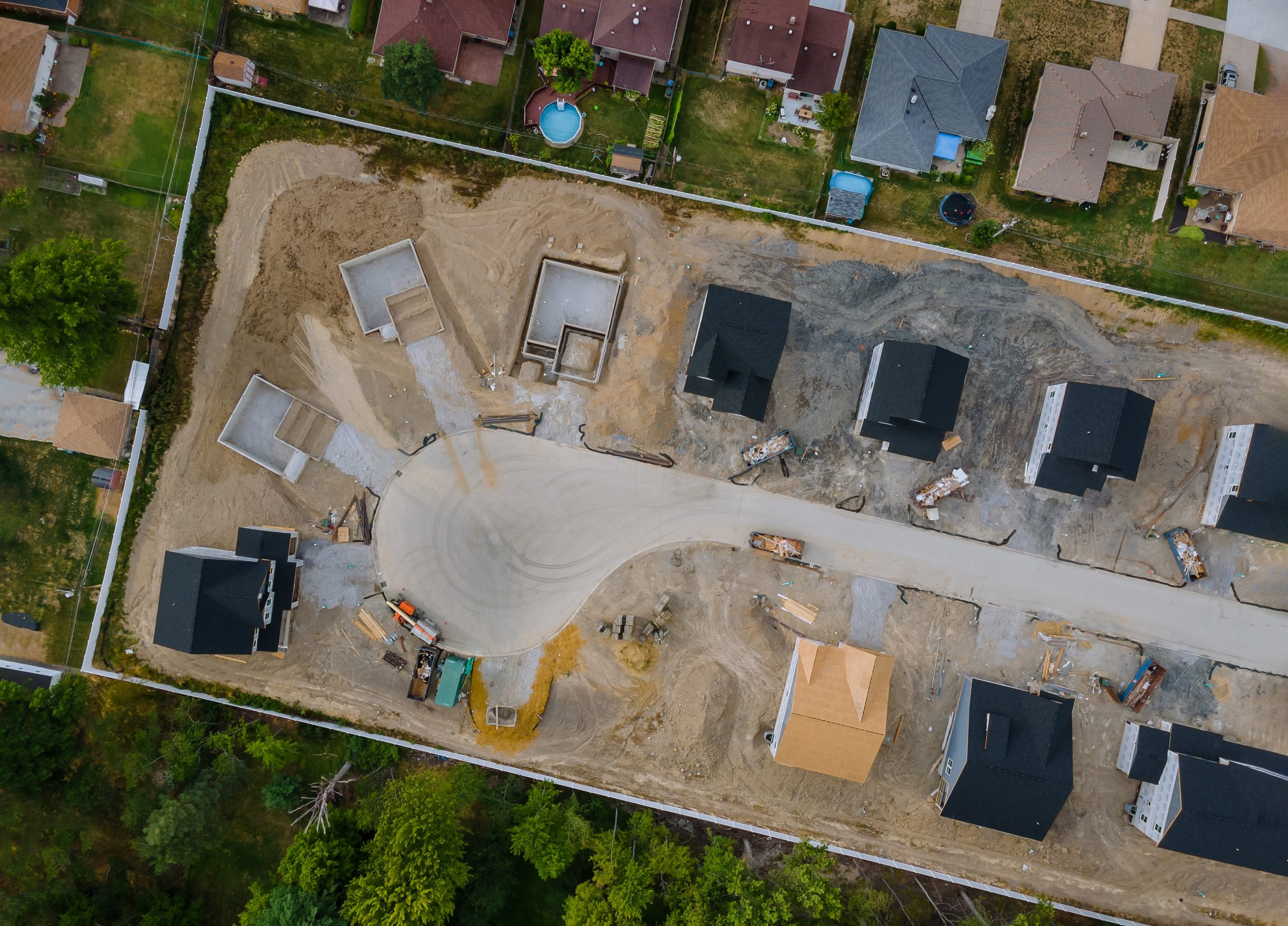Aerial view of suburban housing development under construction.