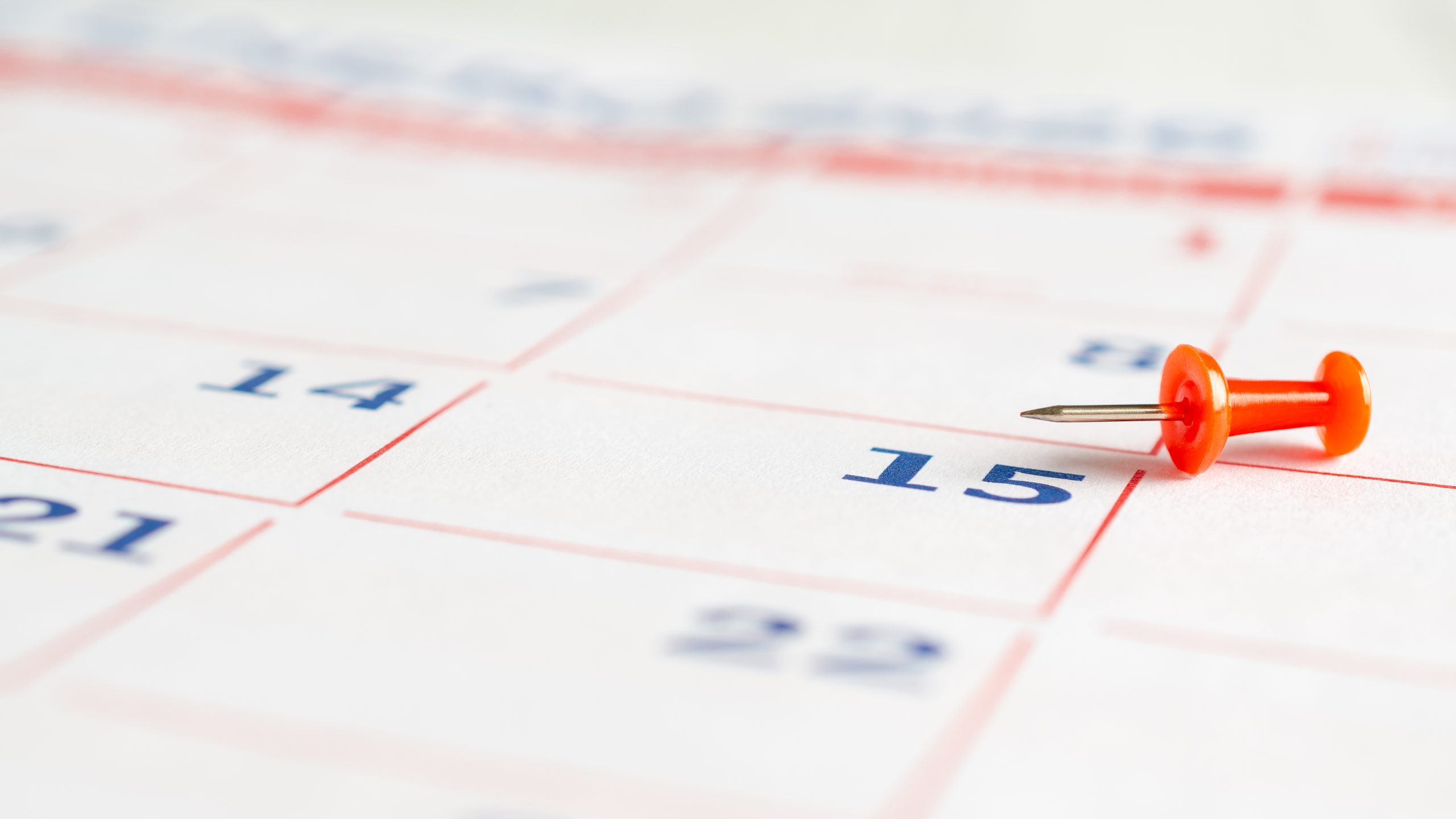 Thumb tack on a calendar